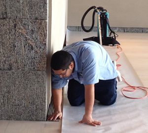 technician cleaning commercial floor