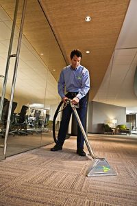 technician cleaning commercial carpet