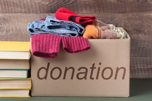 donation box with clothes and books